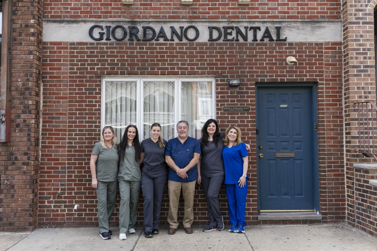 Dr. Robert J. Giordano and the team outside the office on South Broad Street
